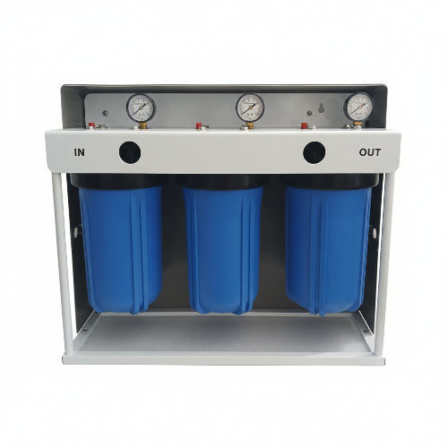 Three blue cylindrical filters with pressure gauges on a white stand against a gray wall.