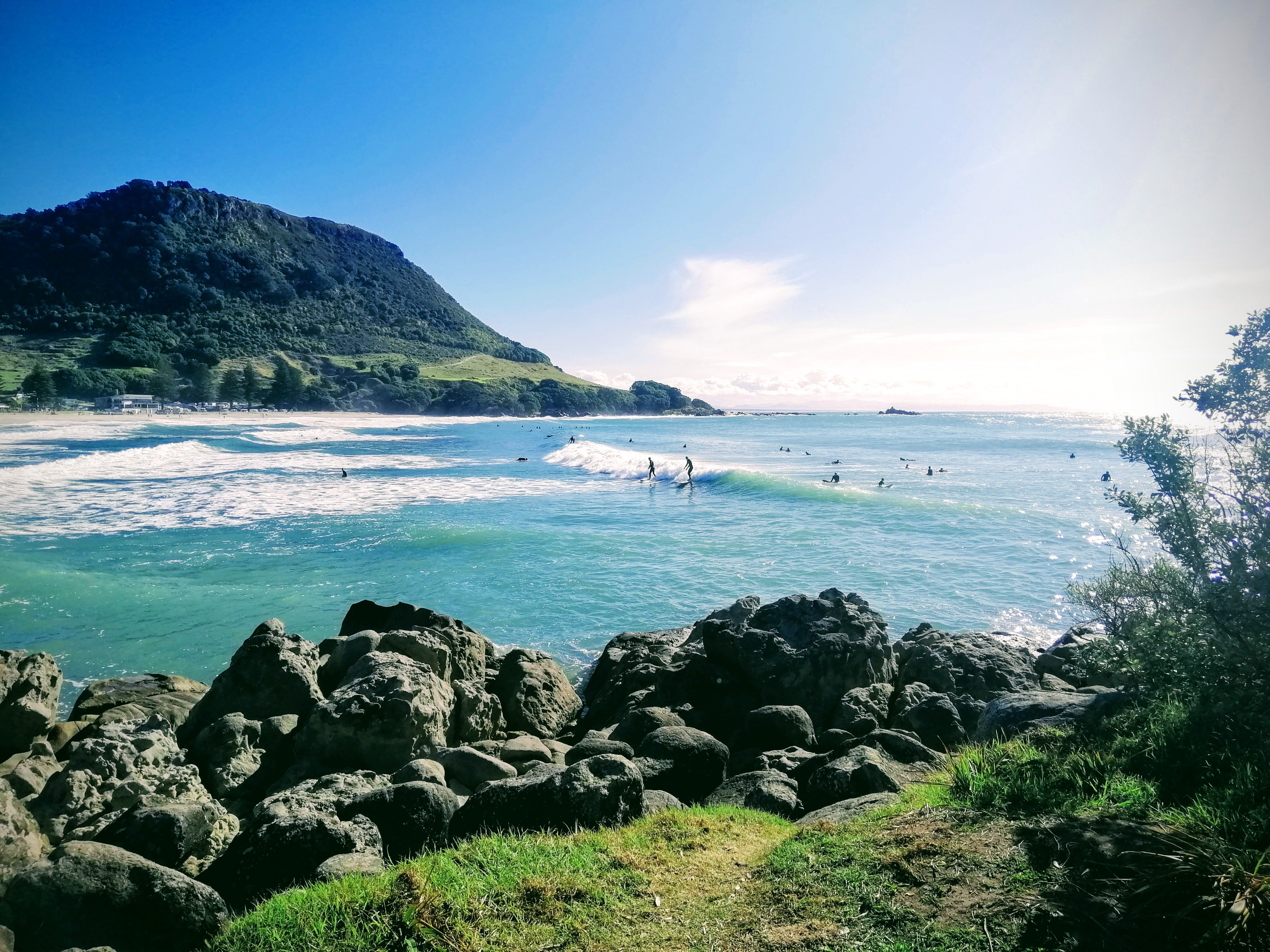 Mount mauganui beach with surfers on waves- NZ Pump and water filters home town