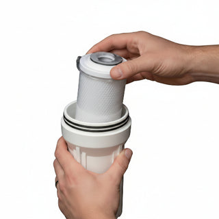 Person assembling a white cylindrical device with black bands, showing close-up details.