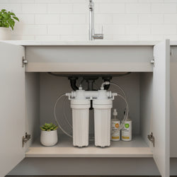 Aquano water filter kit with faucet and accessories on a white background