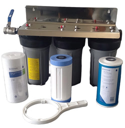 triple home water filter system assembled with 3 filters and a spanner